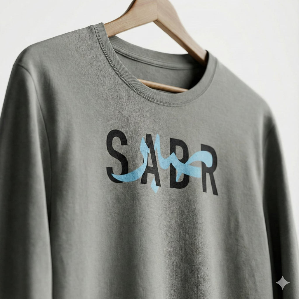 A cool-gray long-sleeve tee finished with a bold SABR graphic for a clean streetwear look.